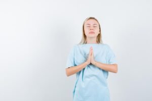 blonde-woman-showing-pleading-gesture-blue-t-shirt-looking-focused_176474-81114-300x200 Heart Opening Yoga Poses