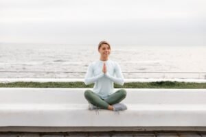 full-shot-woman-meditating-outdoors_23-2149245766-300x200 Is Yoga or Pilates Better for Weight Loss