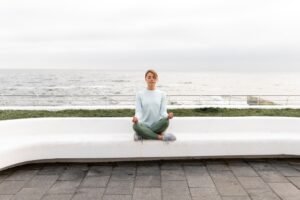 long-shot-woman-meditating-outdoors_23-2149245765-300x200 Is Yoga or Pilates Better for Weight Loss