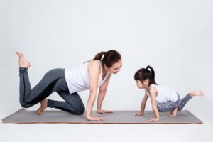 young-mother-training-lovely-daughter-with-yoga_1150-14303-300x200 New Yoga Mom Embracing Yoga for a Healthy, Balanced Life